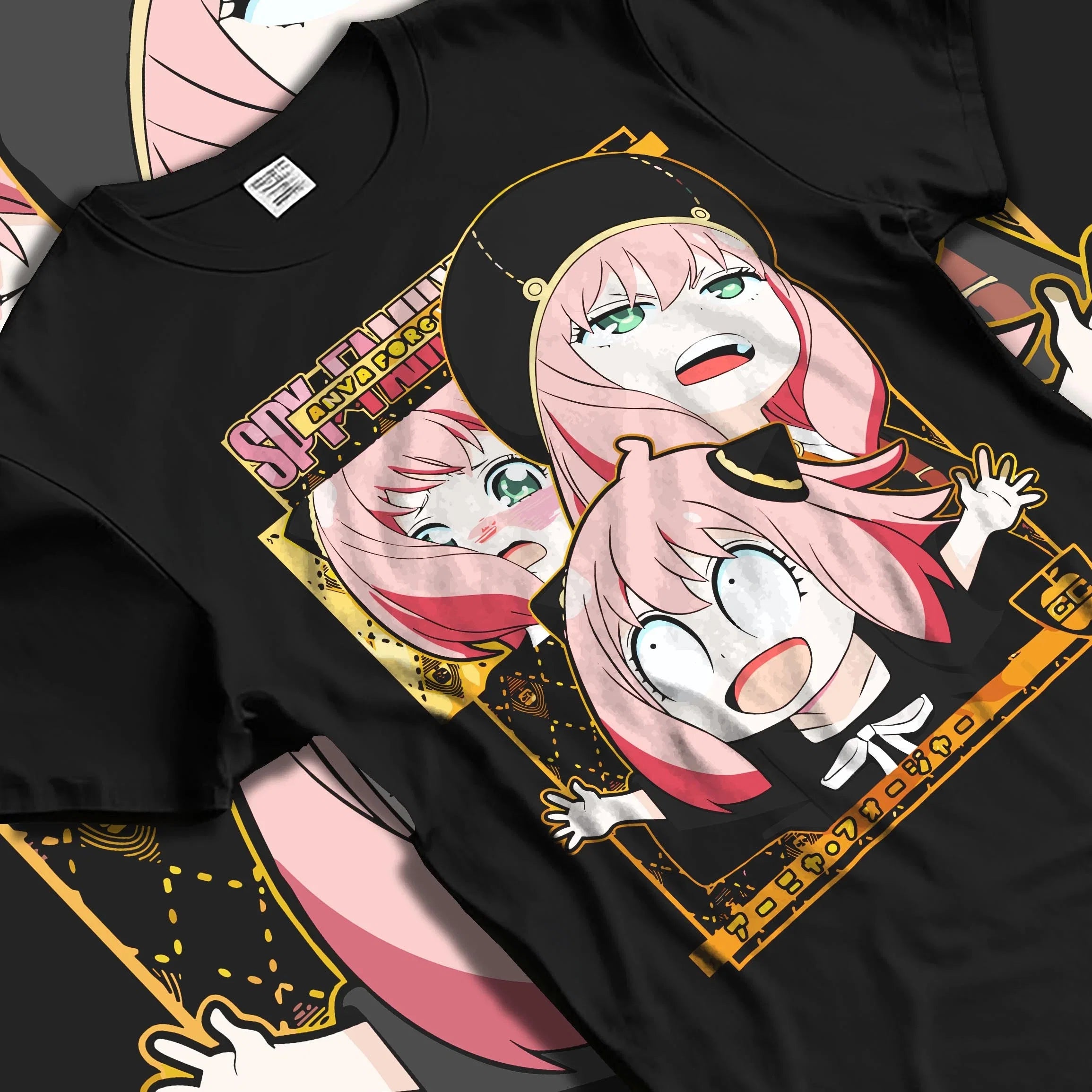 Black T-shirt laid flat featuring Anya Forger from Spy x Family in multiple comic expressions, retro anime streetwear graphic with gold accents.