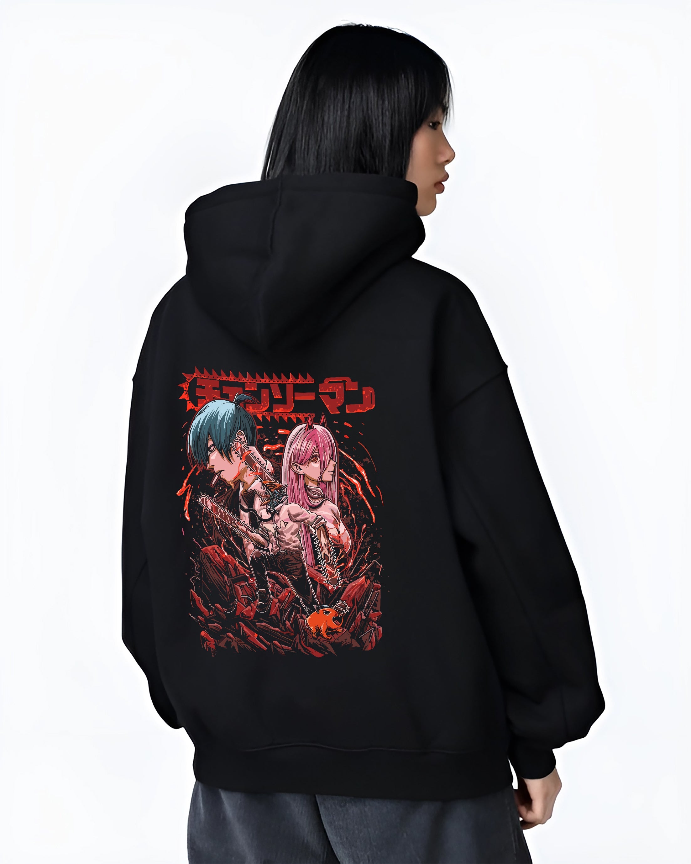 Black hoodie worn by a female model, back view, featuring Chainsaw Man anime poster inspired artwork of Aki and Power with bold retro manga horror style.