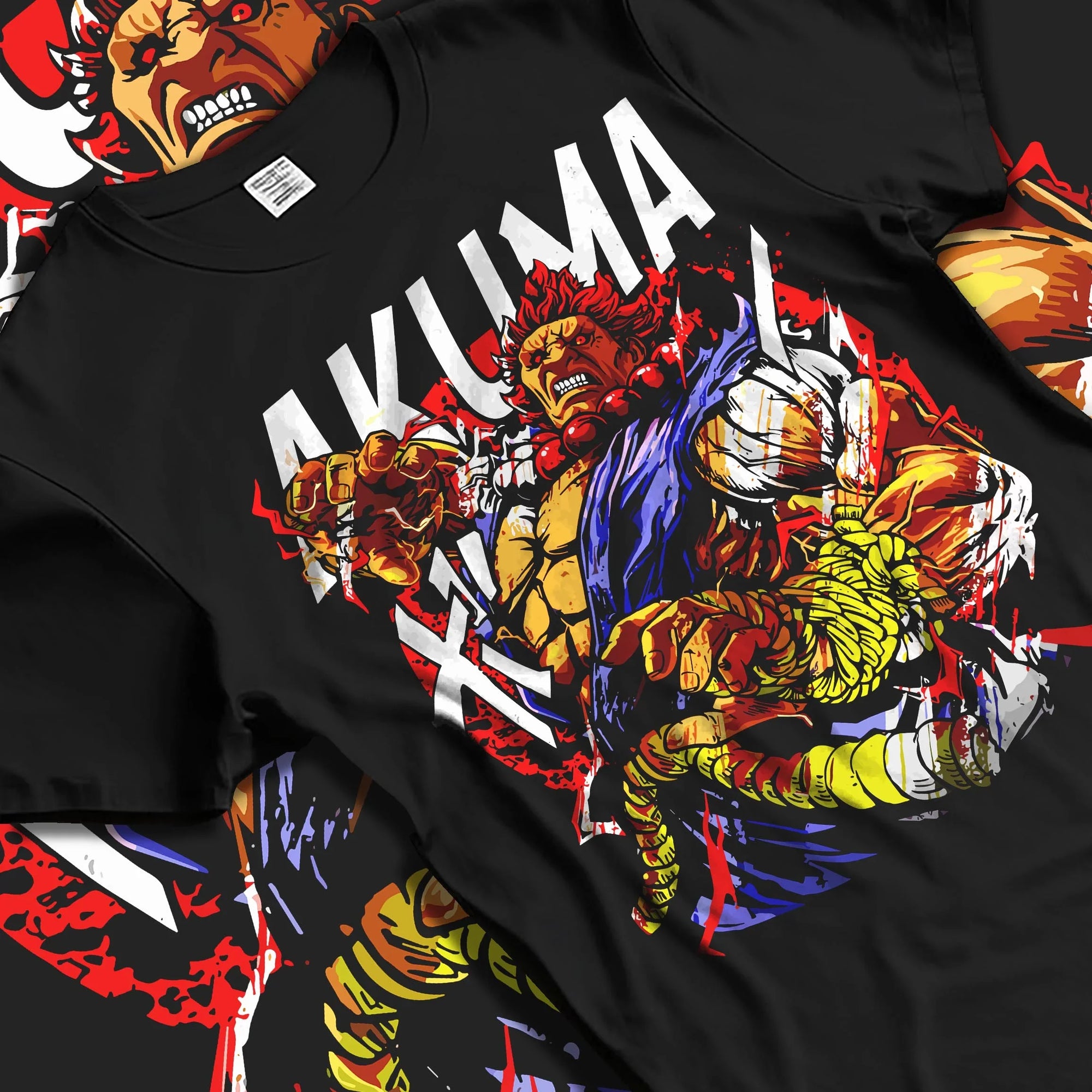 Black T-shirt laid flat with natural folds with Akuma Max Power Hoodie Street Fighter Fiery Demon Aura graphic bold anime graphic.