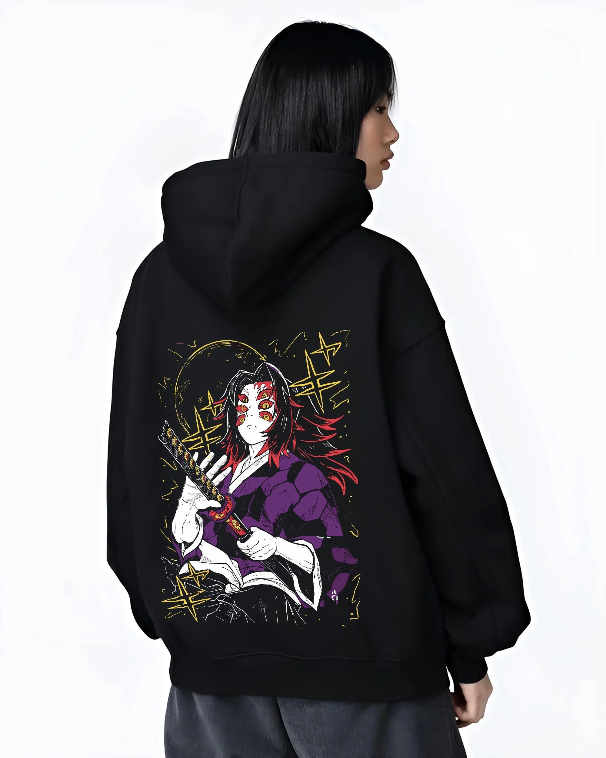 Black hoodie worn by female model, back view with Demon Slayer Kokushibo Hoodie Ancient Samurai Jumper graphic bold anime graphic.
