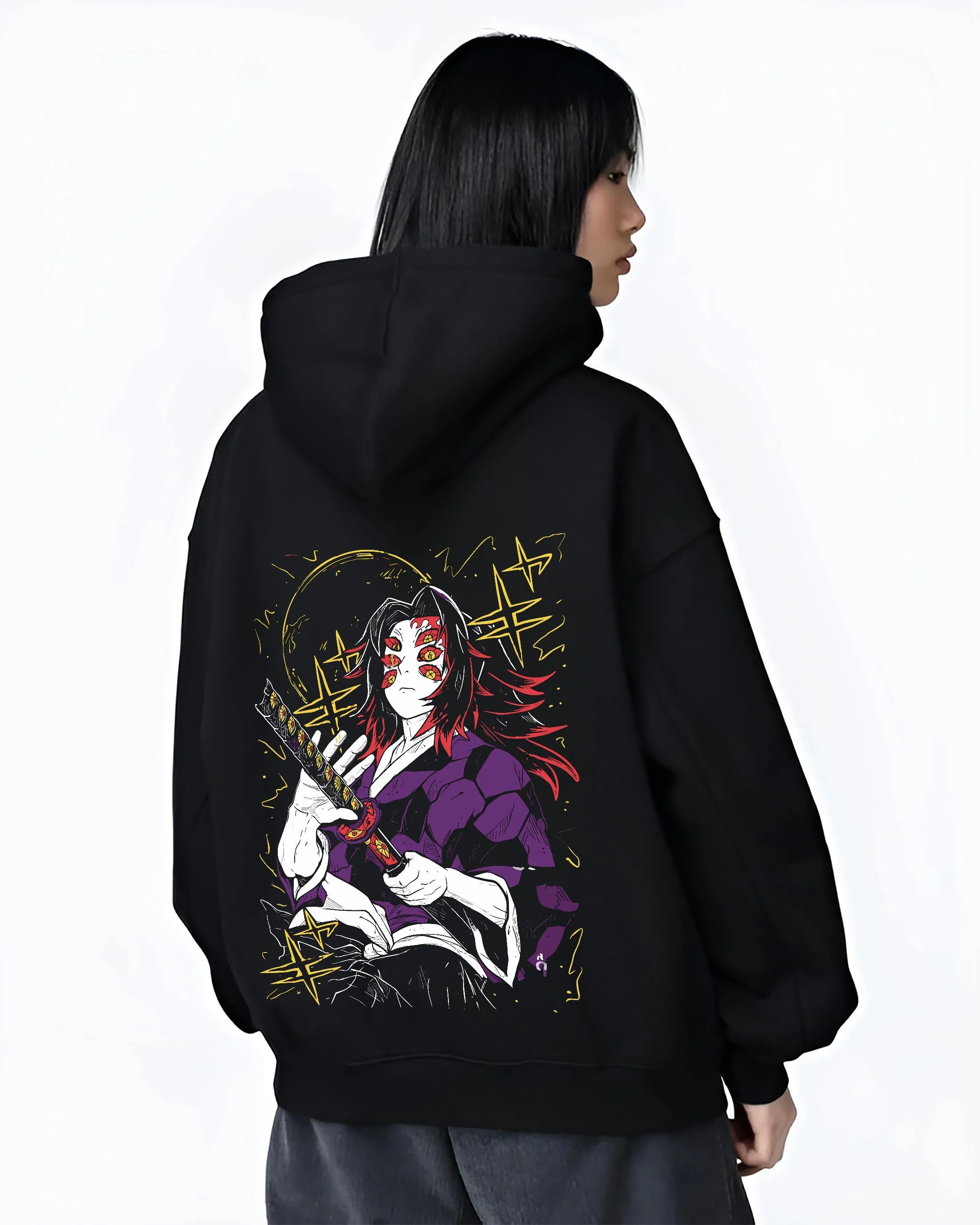 Black hoodie worn by female model, back view with Demon Slayer Kokushibo Hoodie Ancient Samurai Jumper graphic bold anime graphic.