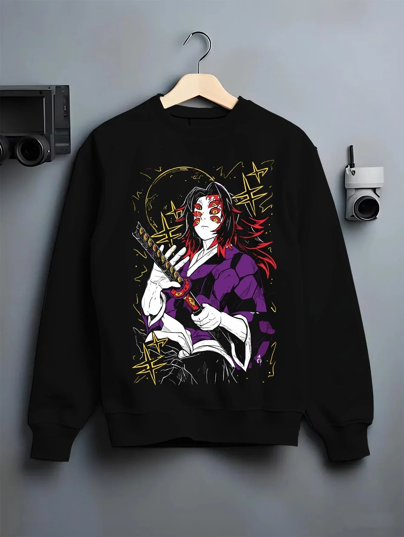 Black crewneck sweatshirt on hanger with Demon Slayer Kokushibo Hoodie Ancient Samurai Jumper graphic bold anime graphic.