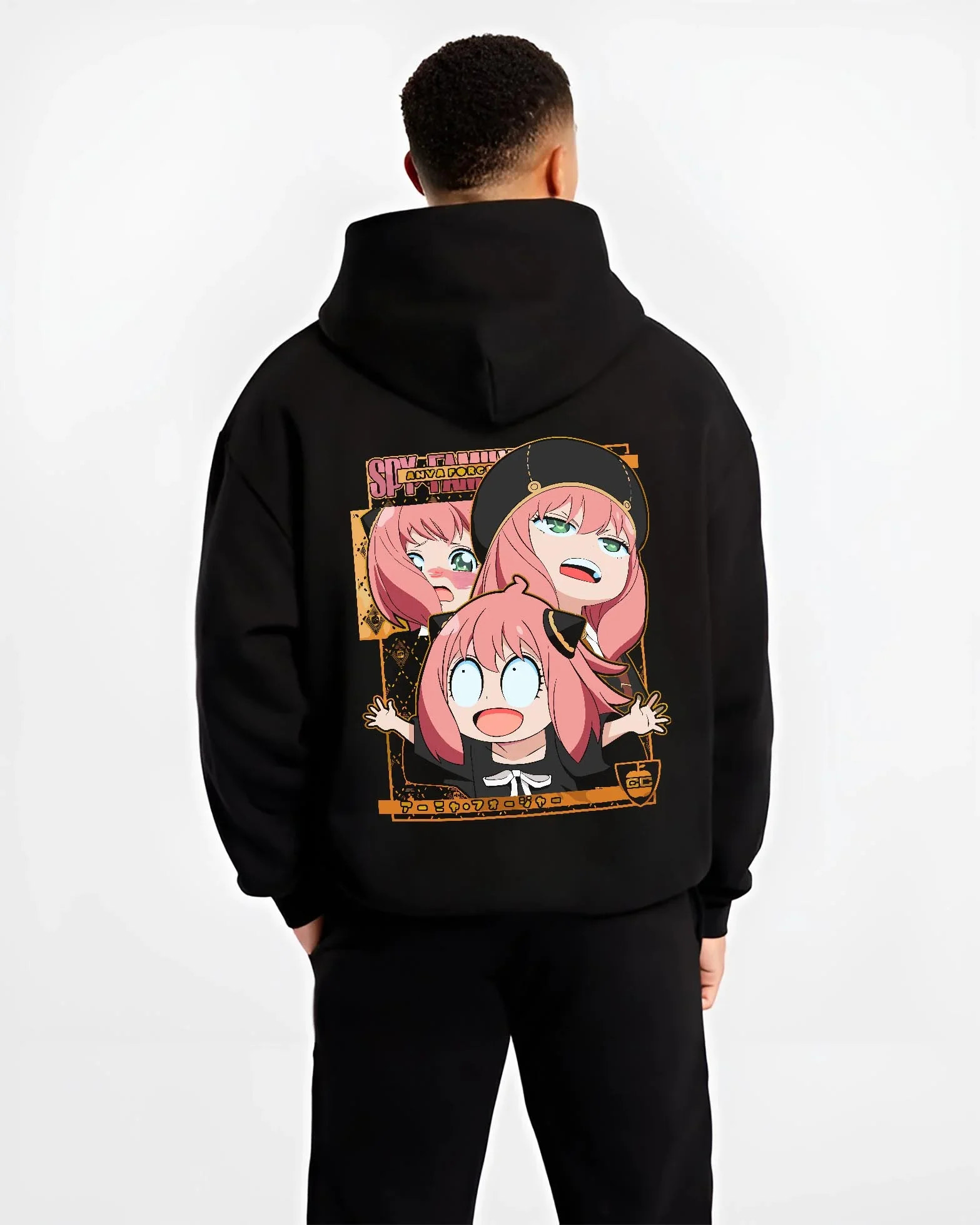 Black hoodie worn by male model, back view with Anya Forger Hoodie Spy x Family Funny Faces Expression graphic bold anime graphic.