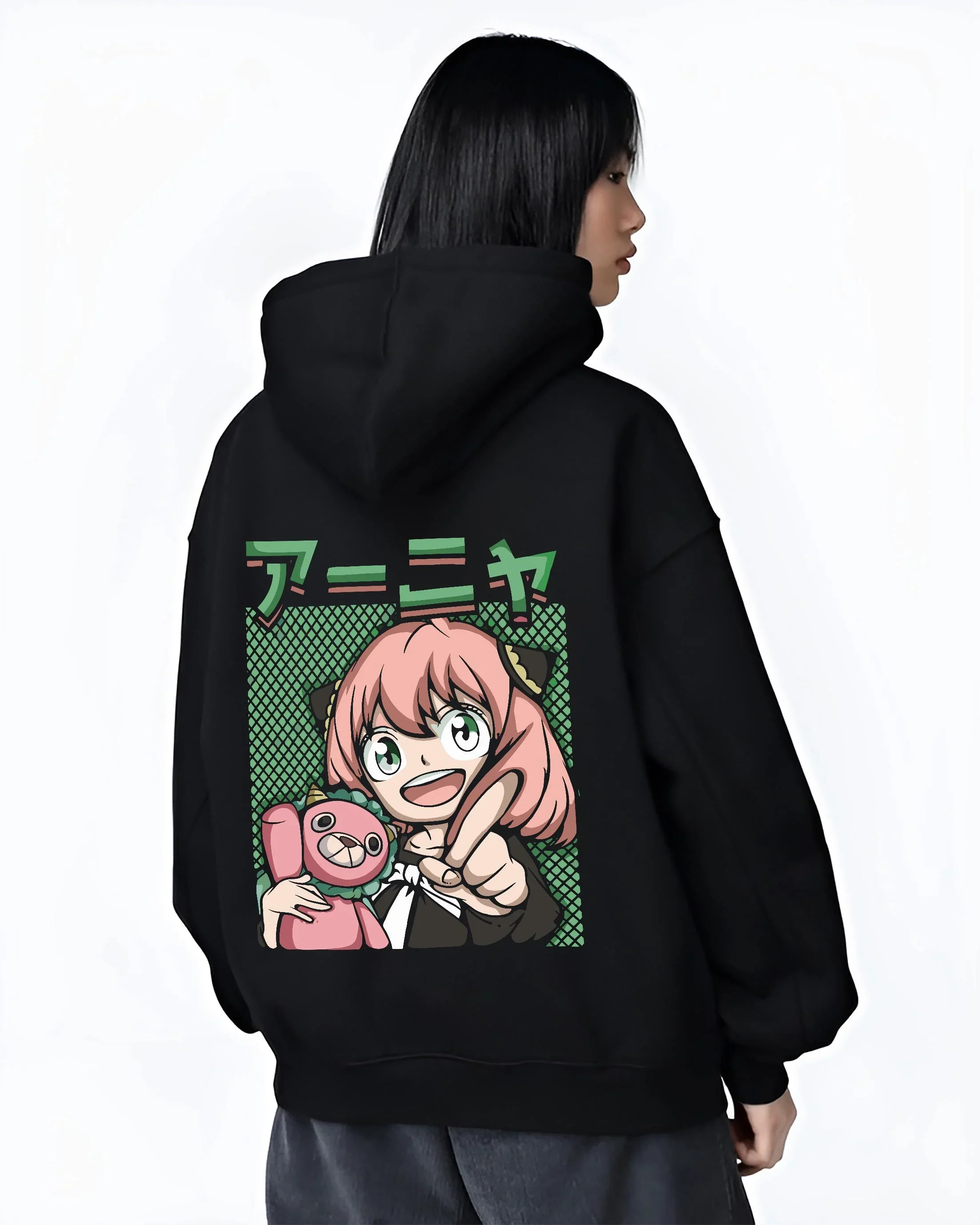 Black hoodie worn by female model, back view with Anya Forger Hoodie Spy x Family Retro Pop Art Smile graphic streetwear graphic.