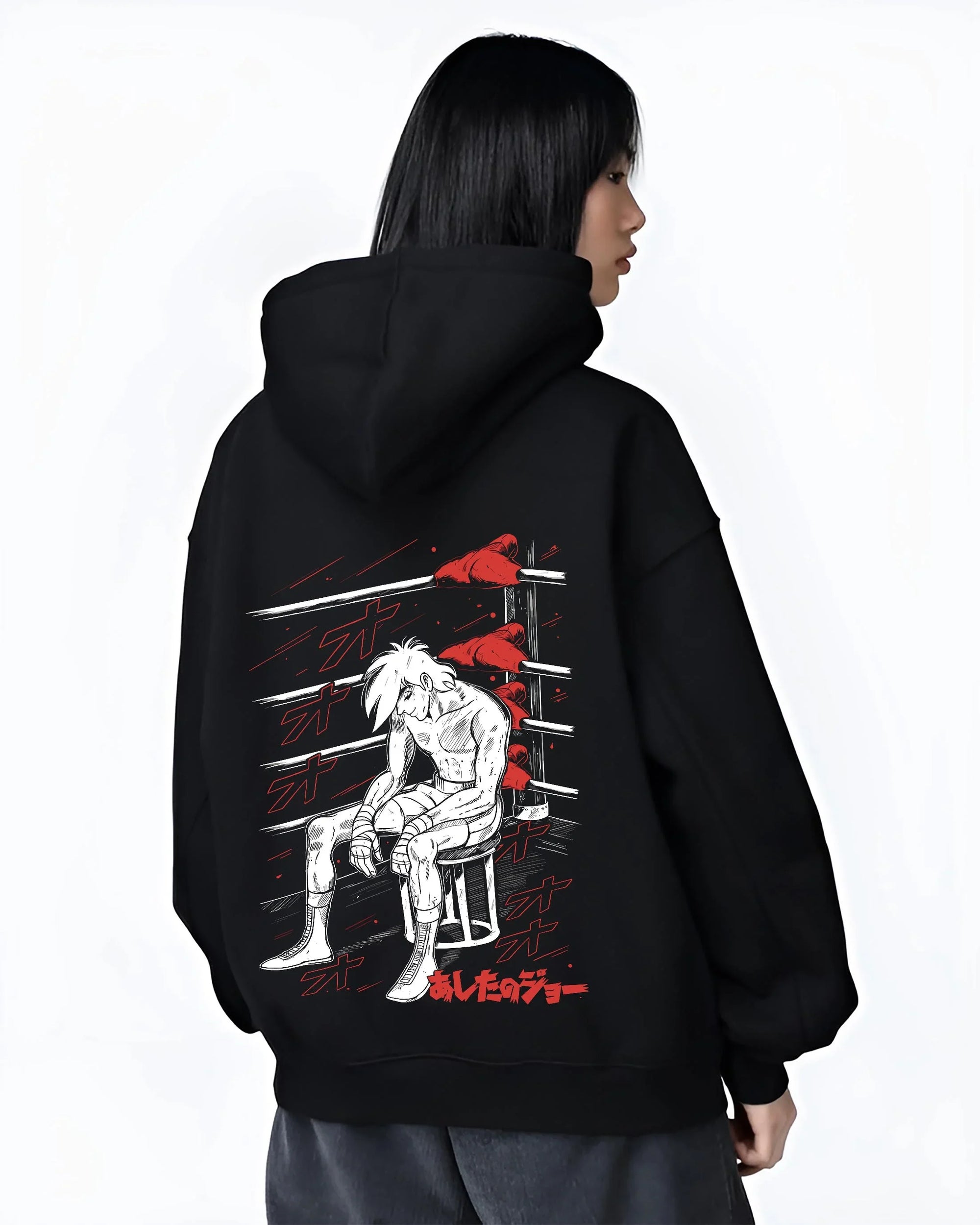 Black hoodie worn by female model, back view with Shiro Hoodie Great Pretender Retro Anime Chair Scene graphic streetwear graphic.