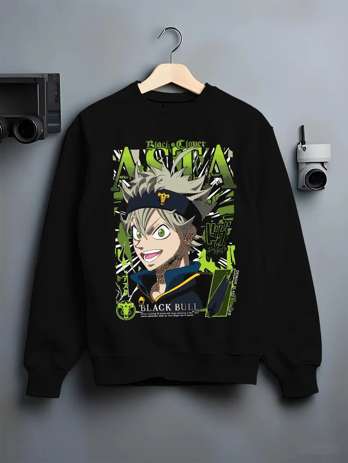 Black crewneck sweatshirt on hanger with Asta Grimoire Hoodie Black Clover Green Magic Energy graphic Asta themed artwork.