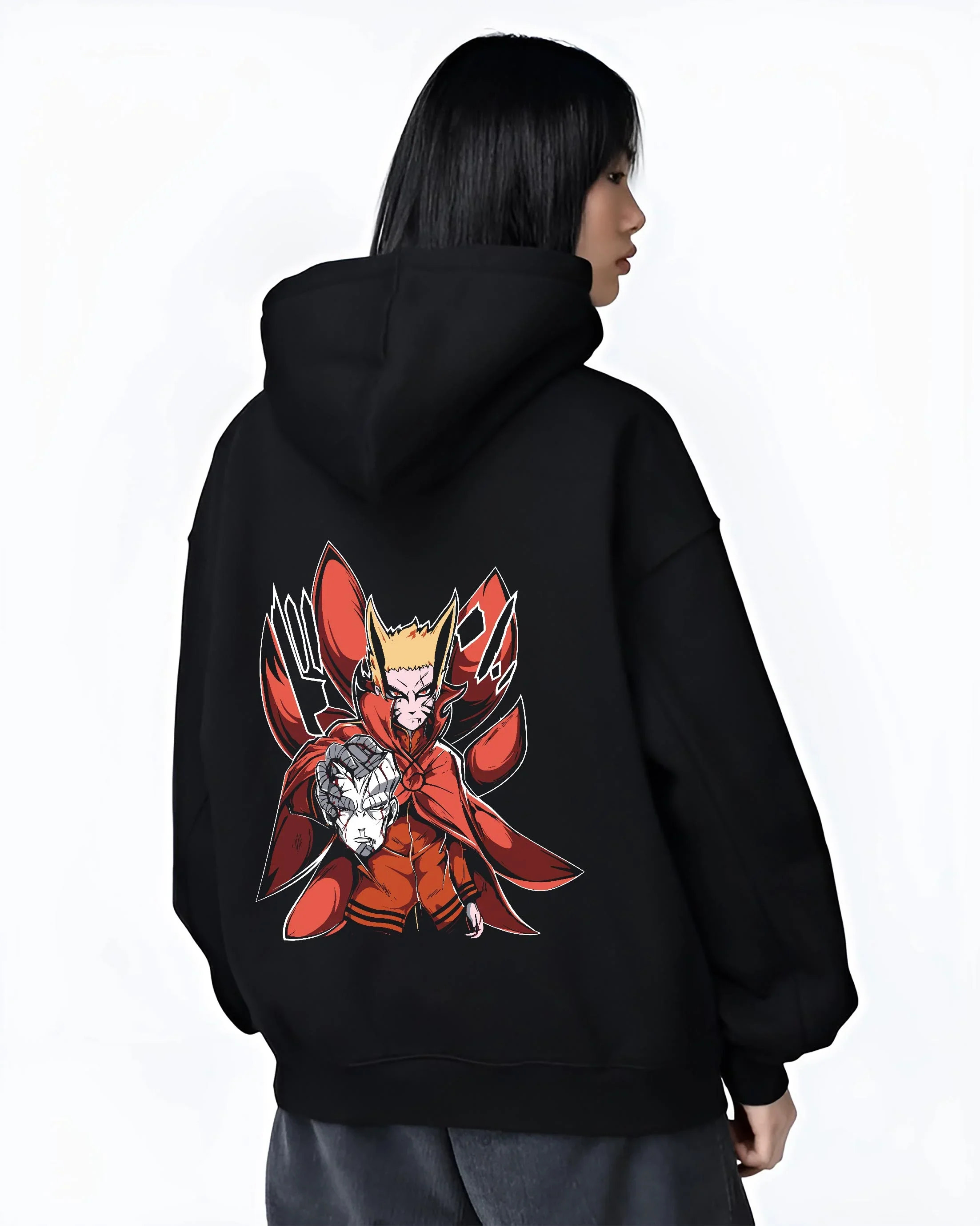 Black hoodie worn by female model, back view with Naruto Uzumaki Hoodie Baryon Mode Battle Jumper graphic streetwear graphic.