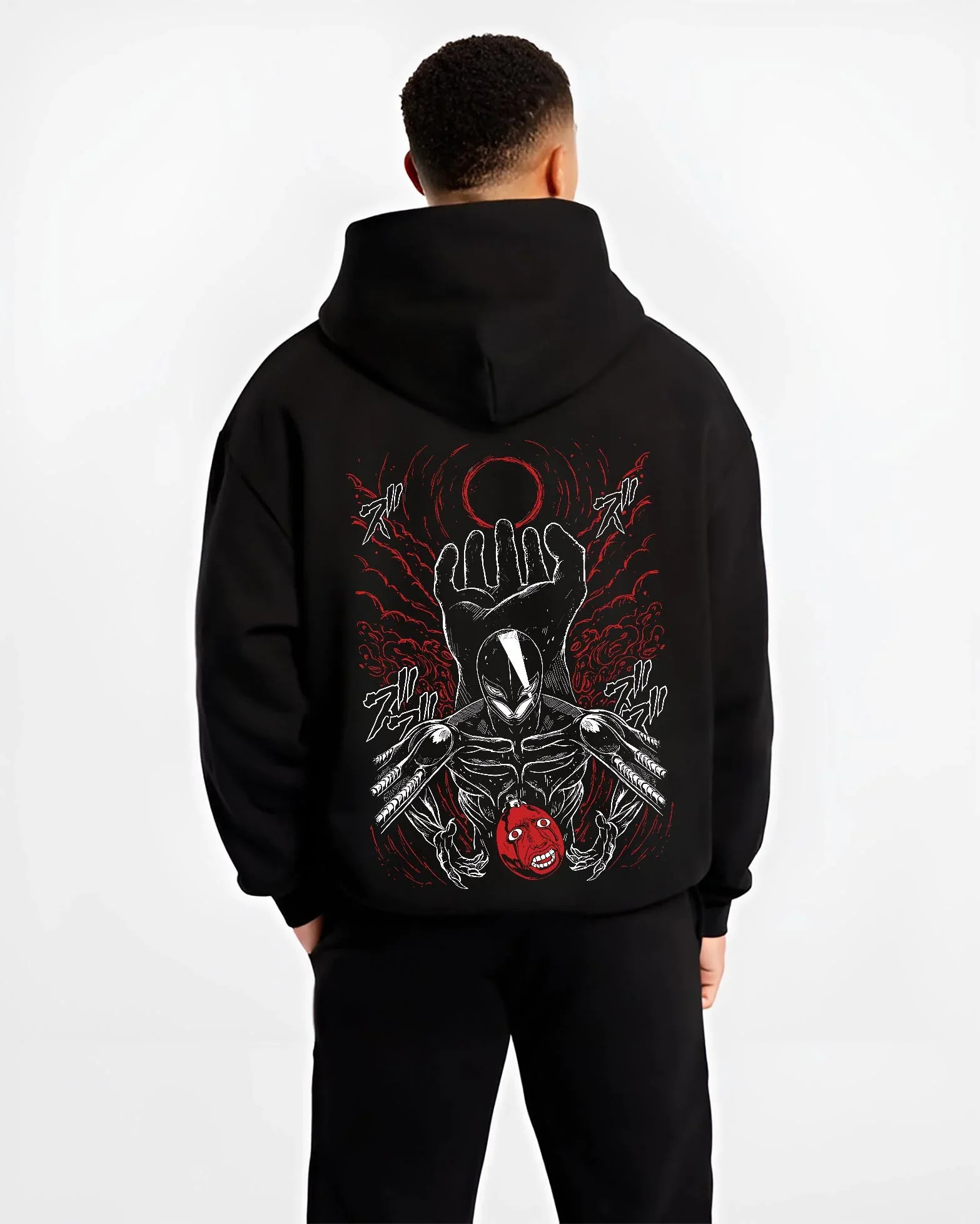 Black hoodie worn by male model, back view with Berserk Eclipse Hoodie Crimson Hand of God Eclipse graphic bold anime graphic.
