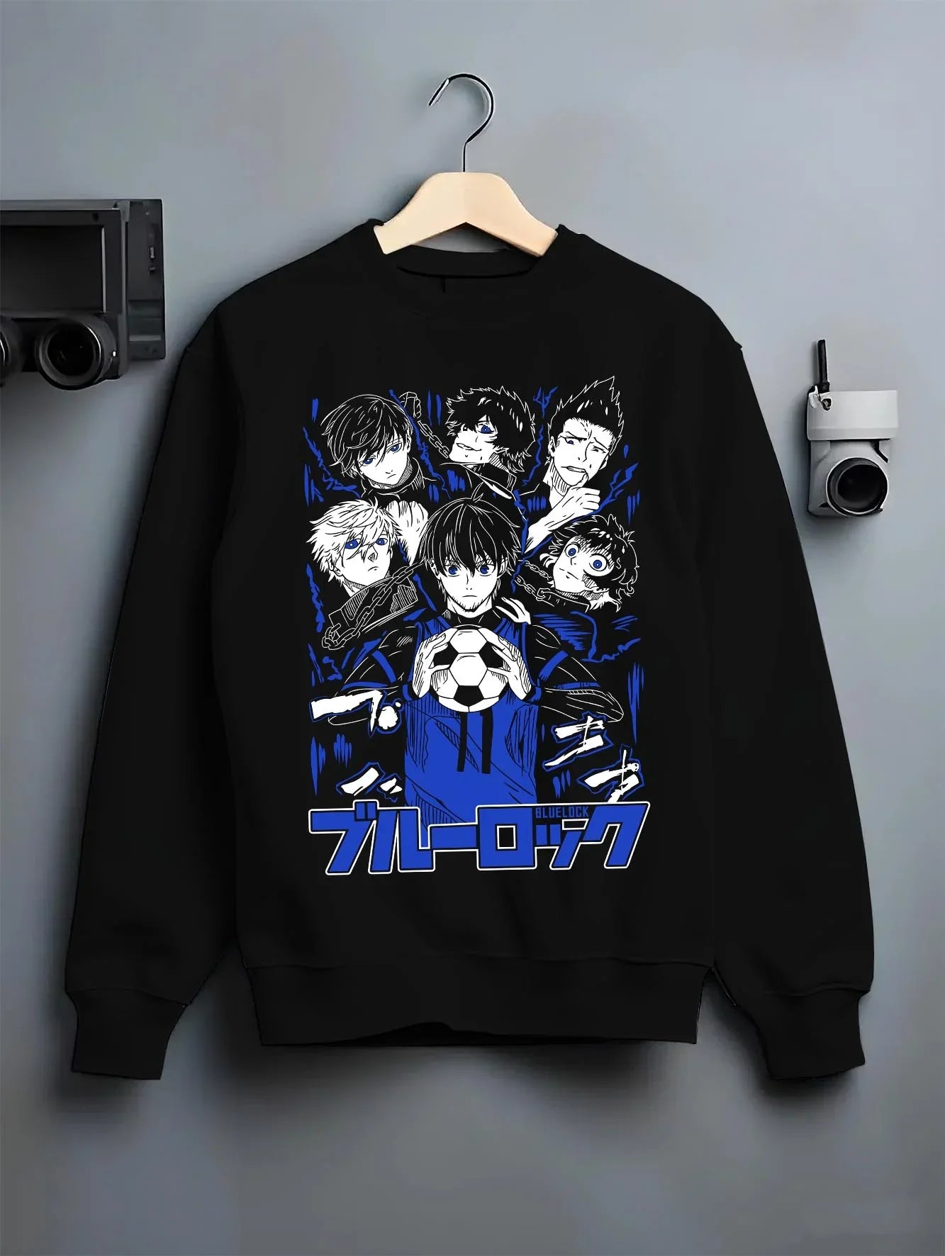 Black crewneck sweatshirt on hanger with Blue Lock Hoodie Japan Soccer Team Chain Collection graphic bold anime graphic.