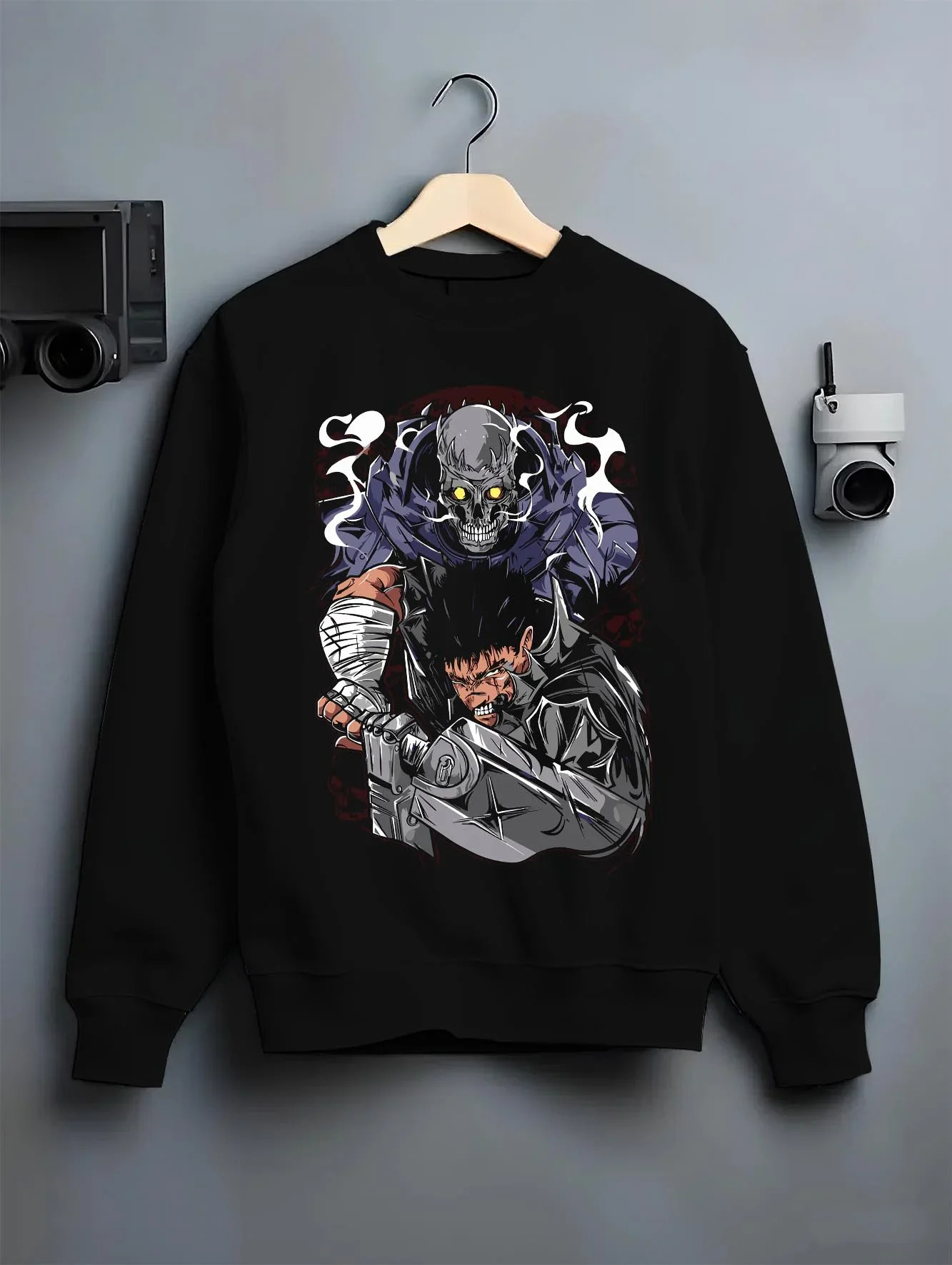 Black crewneck sweatshirt on hanger with Guts Berserk Hoodie Eclipse Hero Dark Blade Poster graphic Guts themed artwork.