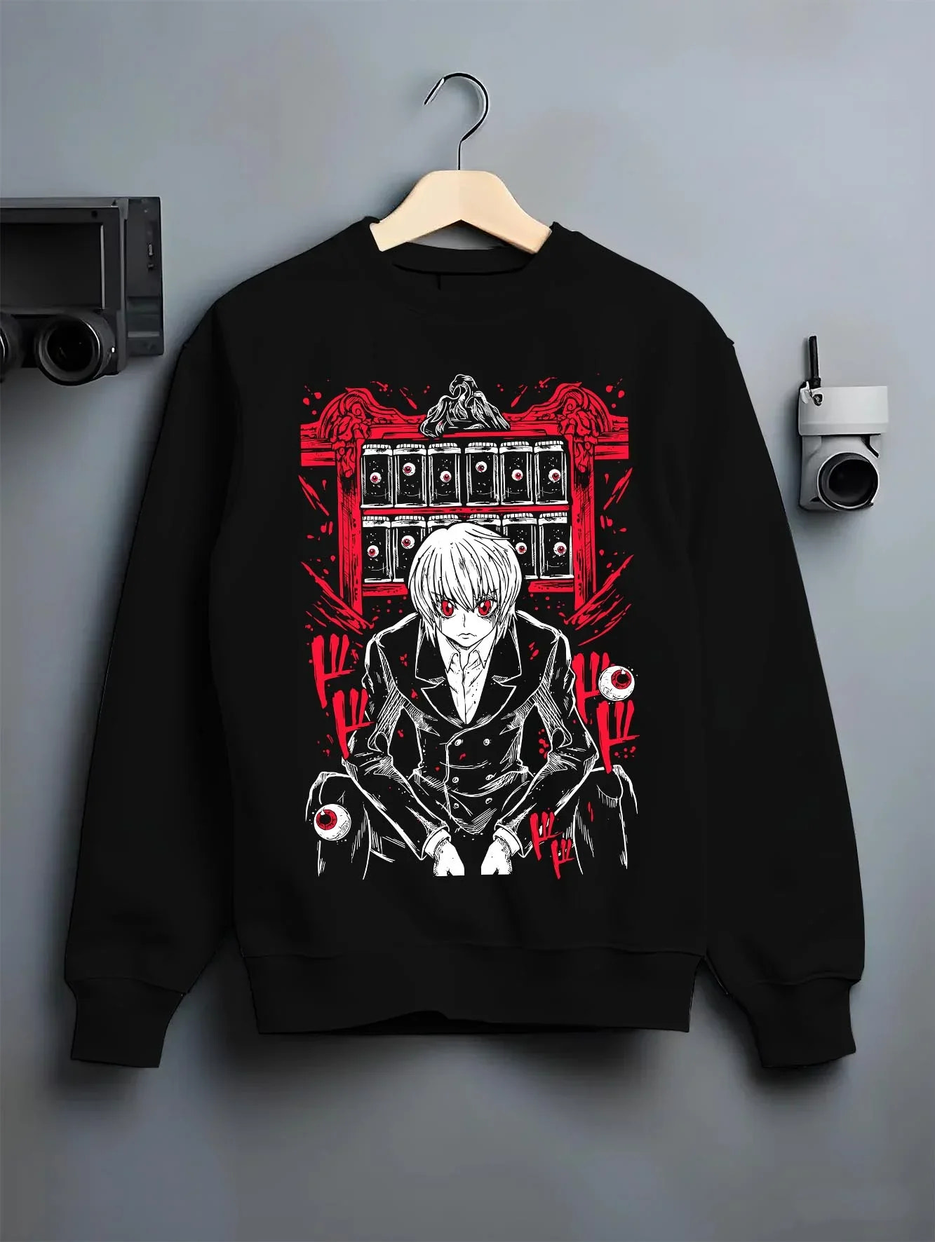 Black crewneck sweatshirt on hanger with Hunter x Hunter Kurapika Hoodie Chain User Jumper graphic bold anime graphic.
