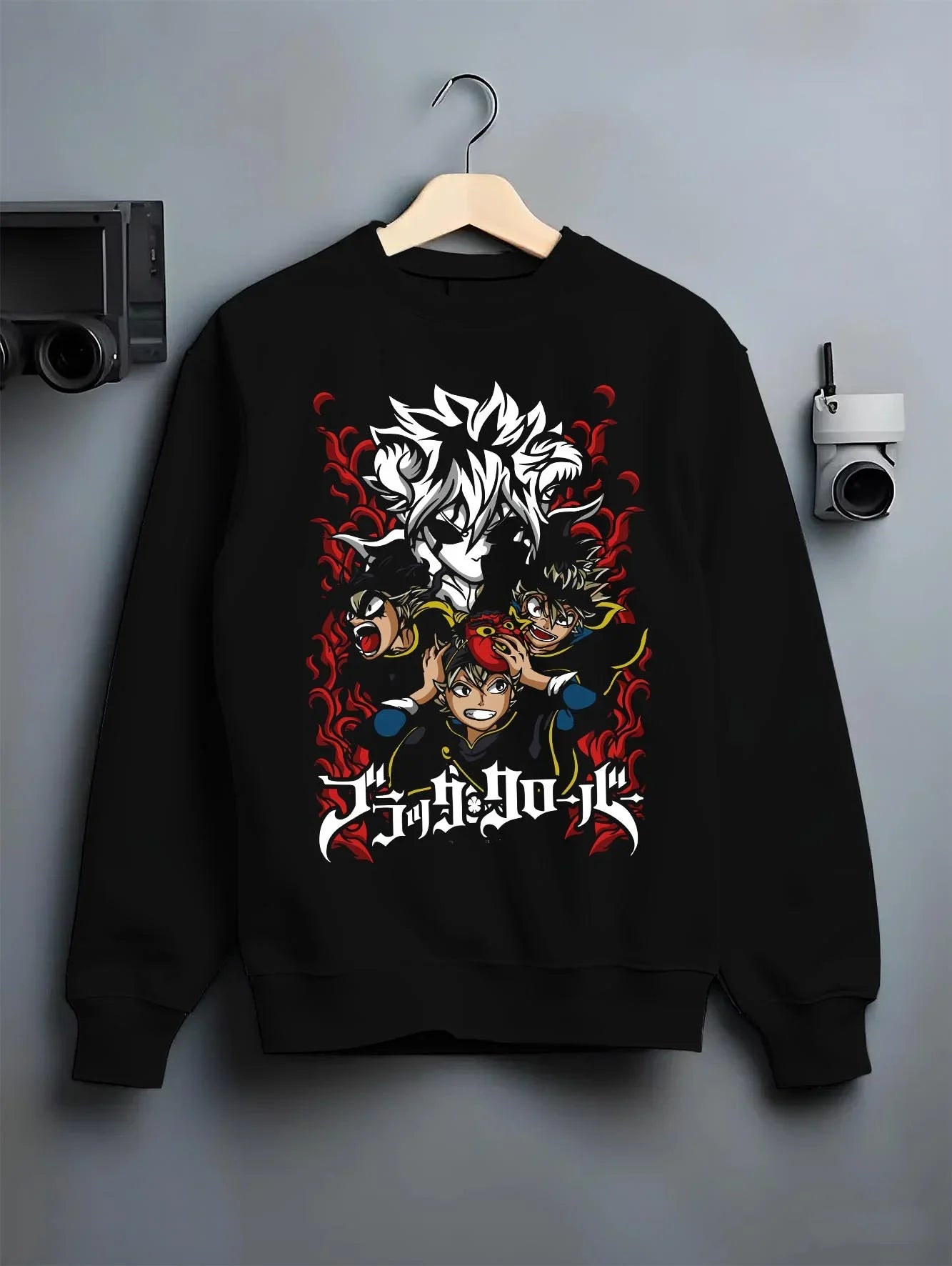Black crewneck sweatshirt on hanger with Asta Hoodie Black Clover Trio Retro Anime Poster graphic streetwear graphic.