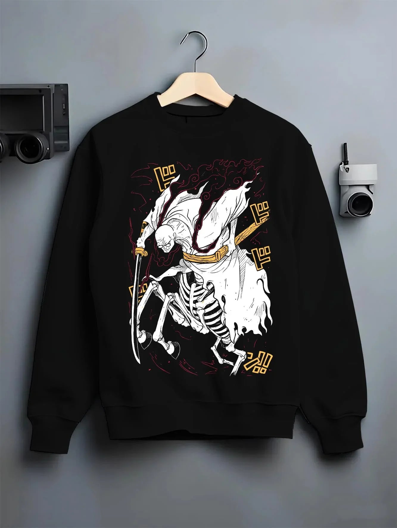 Black crewneck sweatshirt on hanger with One Piece Hoodie Brook Soul King Rising Jumper graphic streetwear graphic.