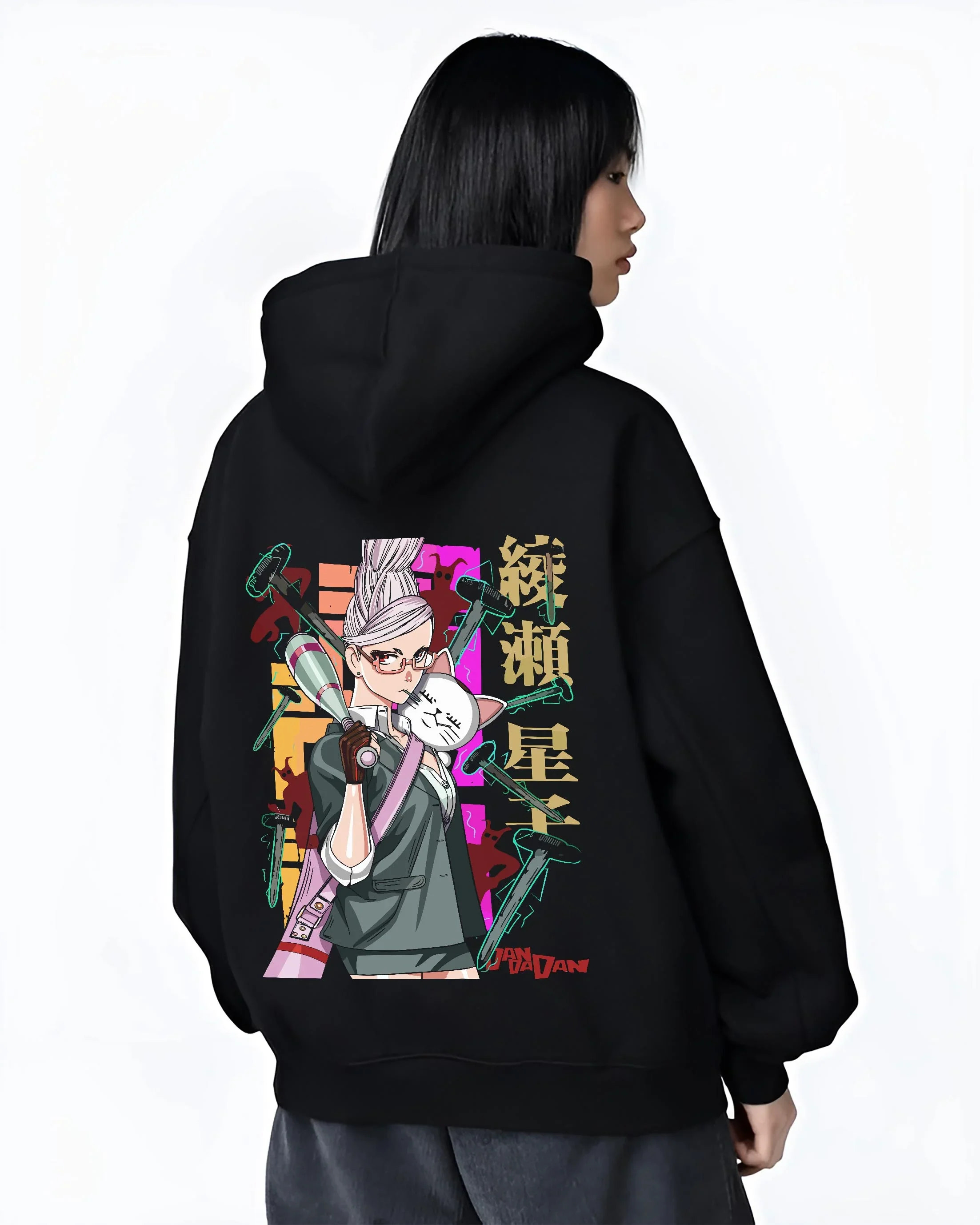 Black hoodie worn by a female model, back view, featuring Japanese animation streetwear graphic of Aira Shiratori from Dandadan.