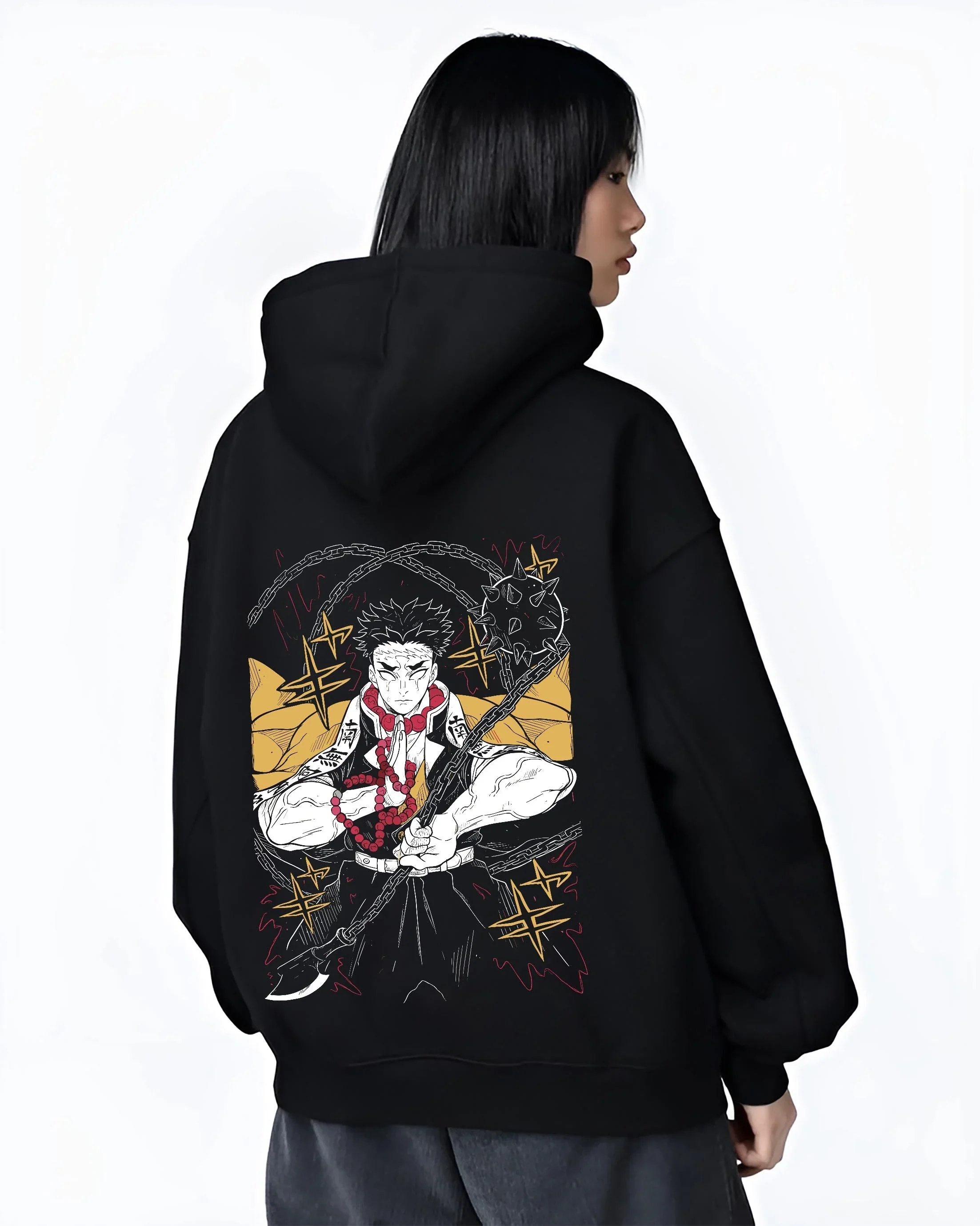 Black hoodie worn by female model, back view with Demon Slayer Hoodie Gyomei Himejima Prayer Pose Jumper graphic streetwear graphic.