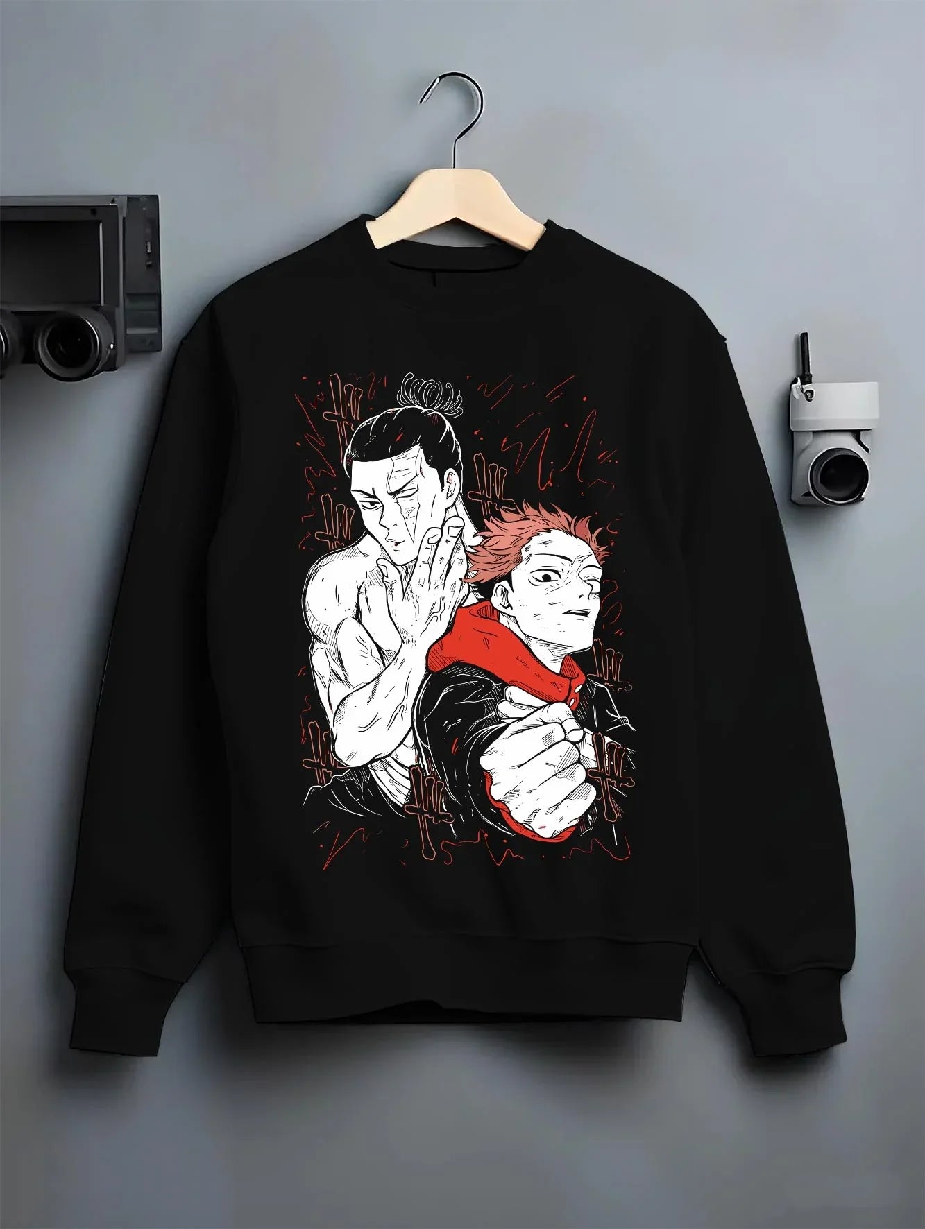 Black crewneck sweatshirt on hanger with Jujutsu Kaisen Hoodie Ijichi Kiyotaka Assistant Jumper graphic streetwear graphic.