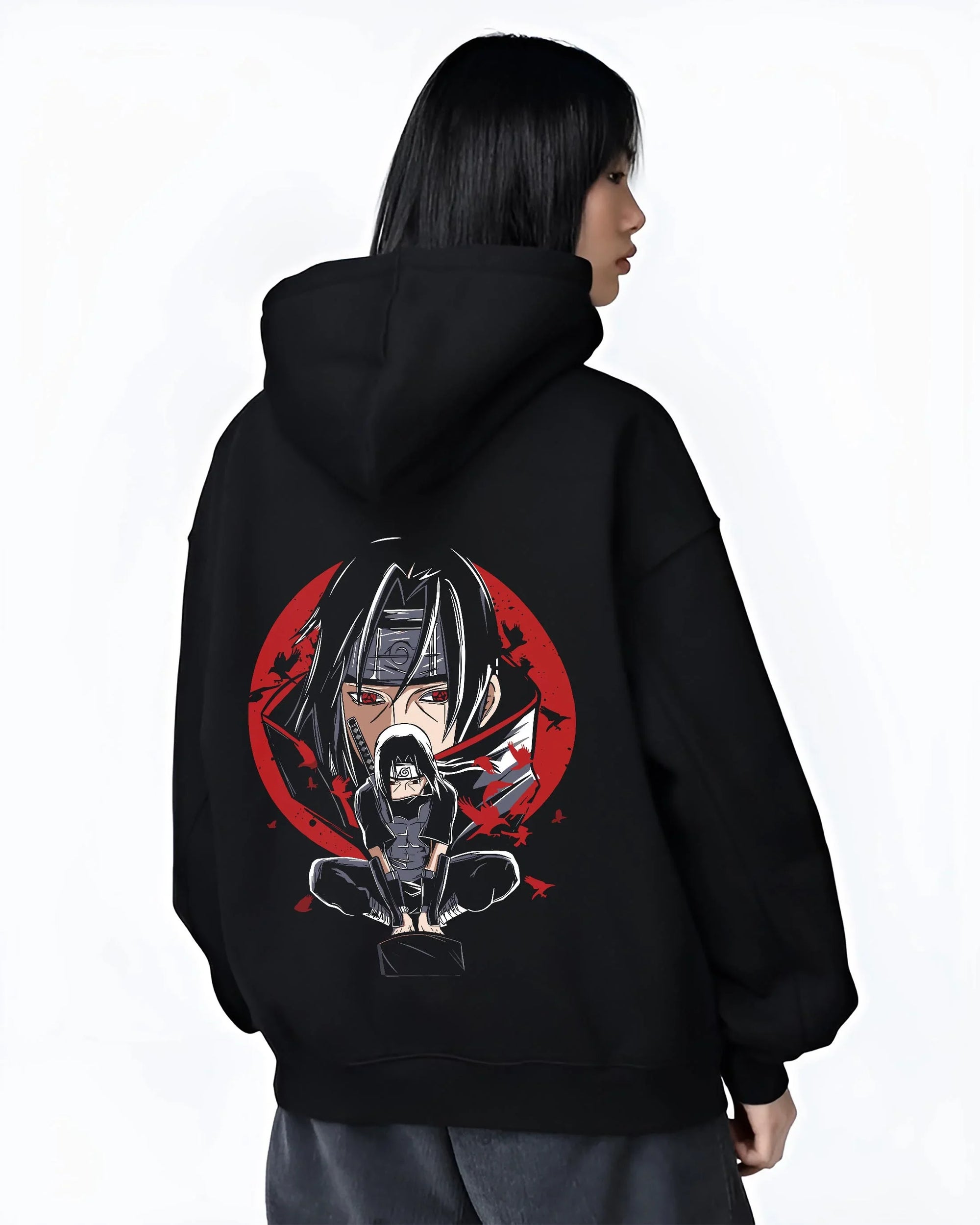 Black hoodie worn by female model, back view with Naruto Hoodie Itachi Uchiha Mangekyo Clan Jumper graphic streetwear graphic.