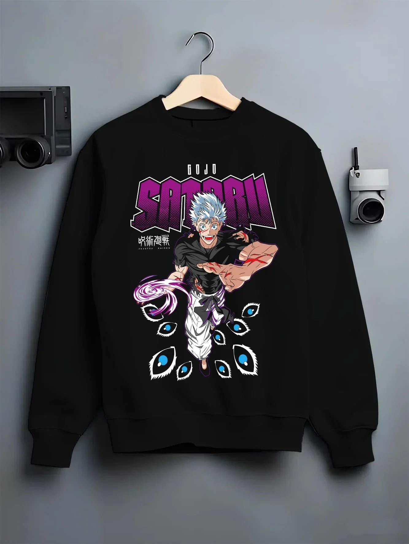 Black crewneck sweatshirt on hanger with Jujutsu Kaisen Hoodie Satoru Gojo Mystic Power Jumper graphic premium wear.