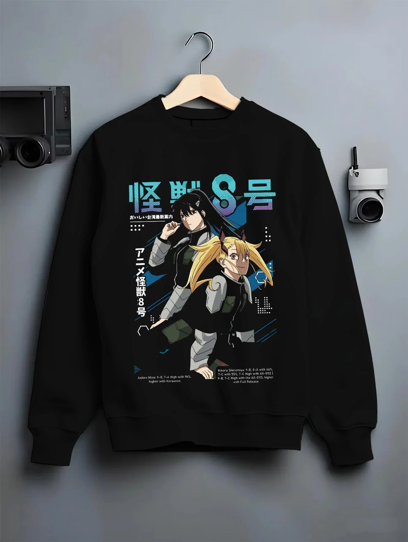 Black crewneck sweatshirt on hanger with Kaiju No. 8 Hoodie Defense Force Team Stance graphic premium wear.