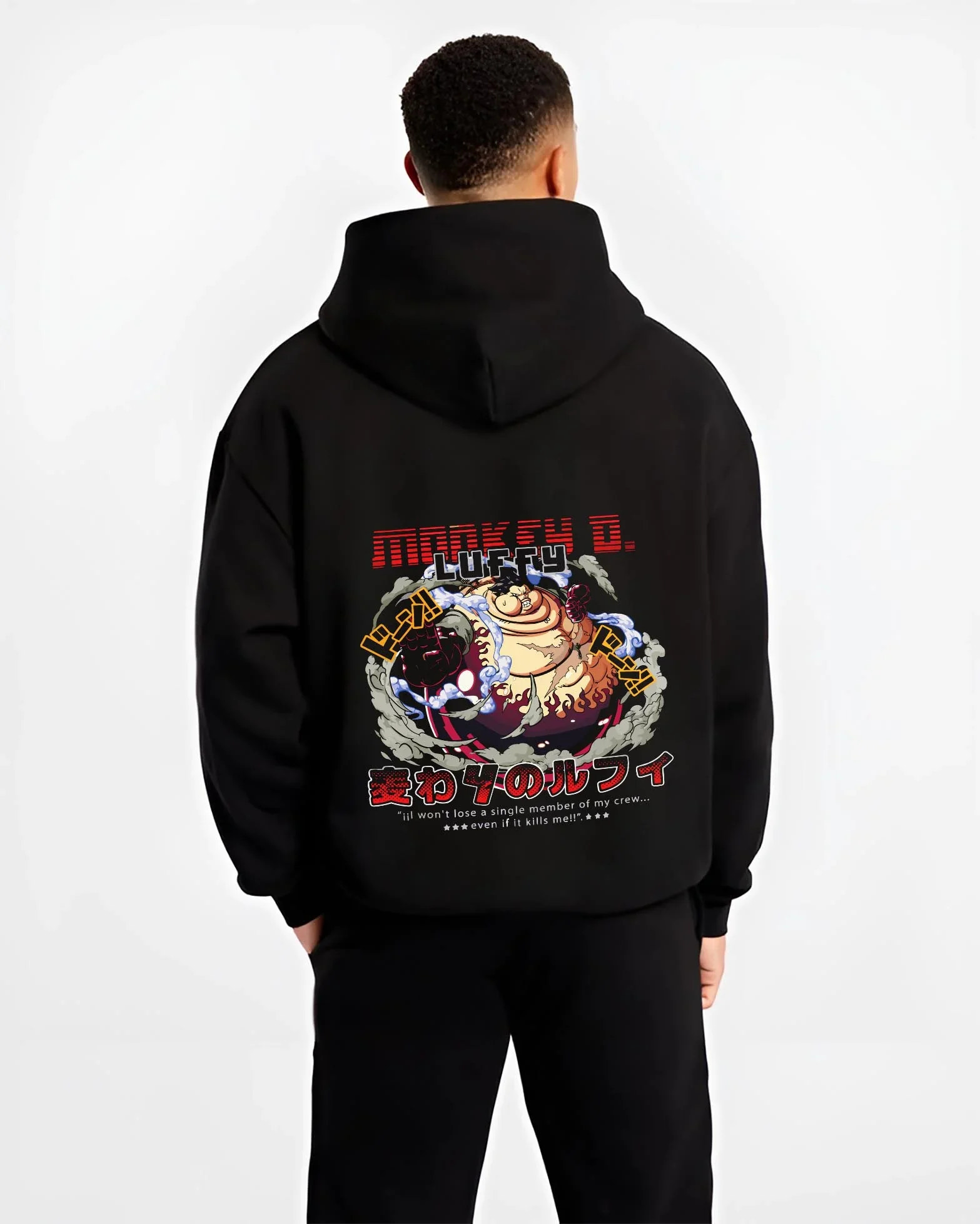 Black hoodie worn by a male model, back view, featuring Monkey D. Luffy Gear Fourth retro manga artwork print from One Piece.