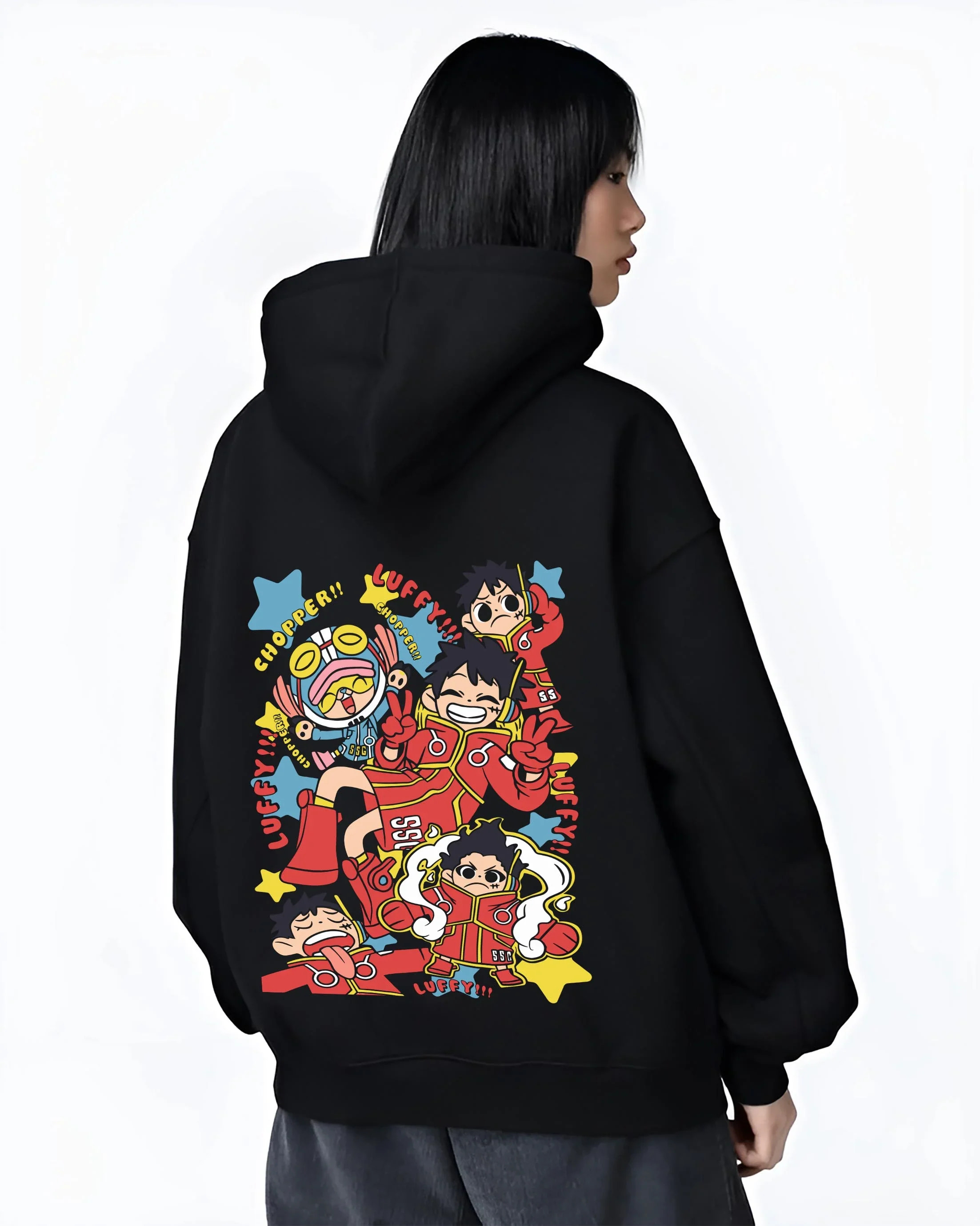 Black hoodie worn by female model, back view showing bold retro manga graphic of Luffy and Chopper from One Piece anime.
