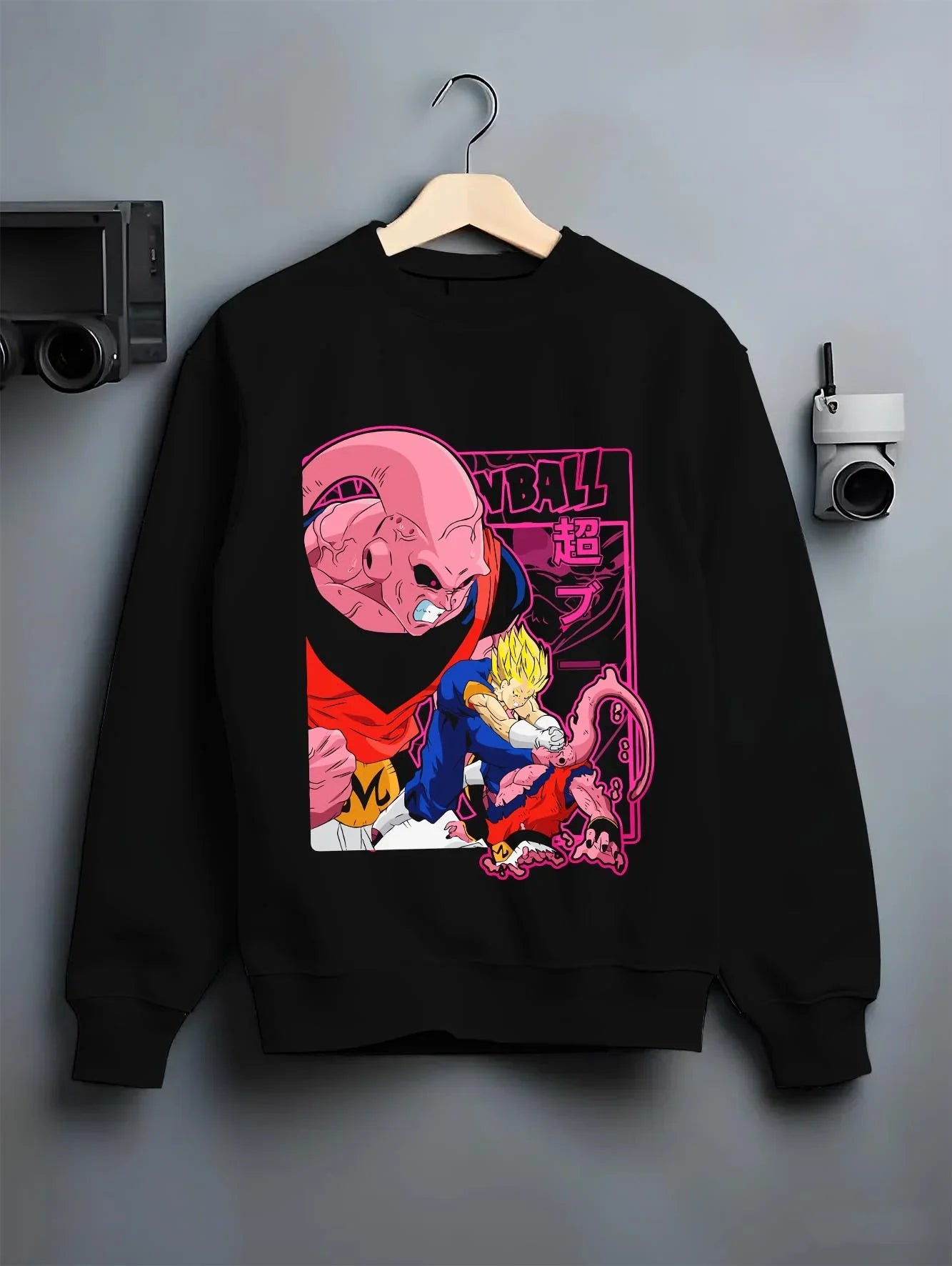 Black crewneck sweatshirt on hanger with Majin Buu Hoodie Dragon Ball Z Evil Form graphic streetwear graphic.
