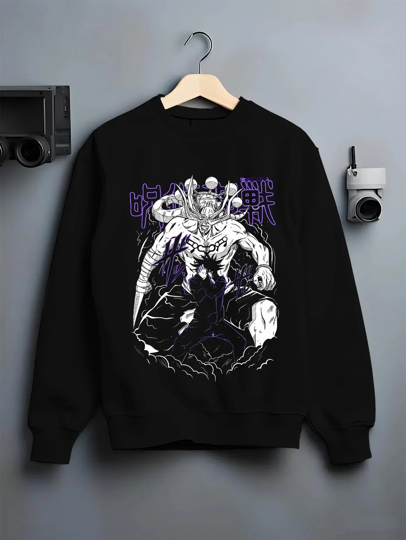 Black crewneck sweatshirt on hanger, featuring retro streetwear graphic of Mahoraga and Megumi Shikigami design.