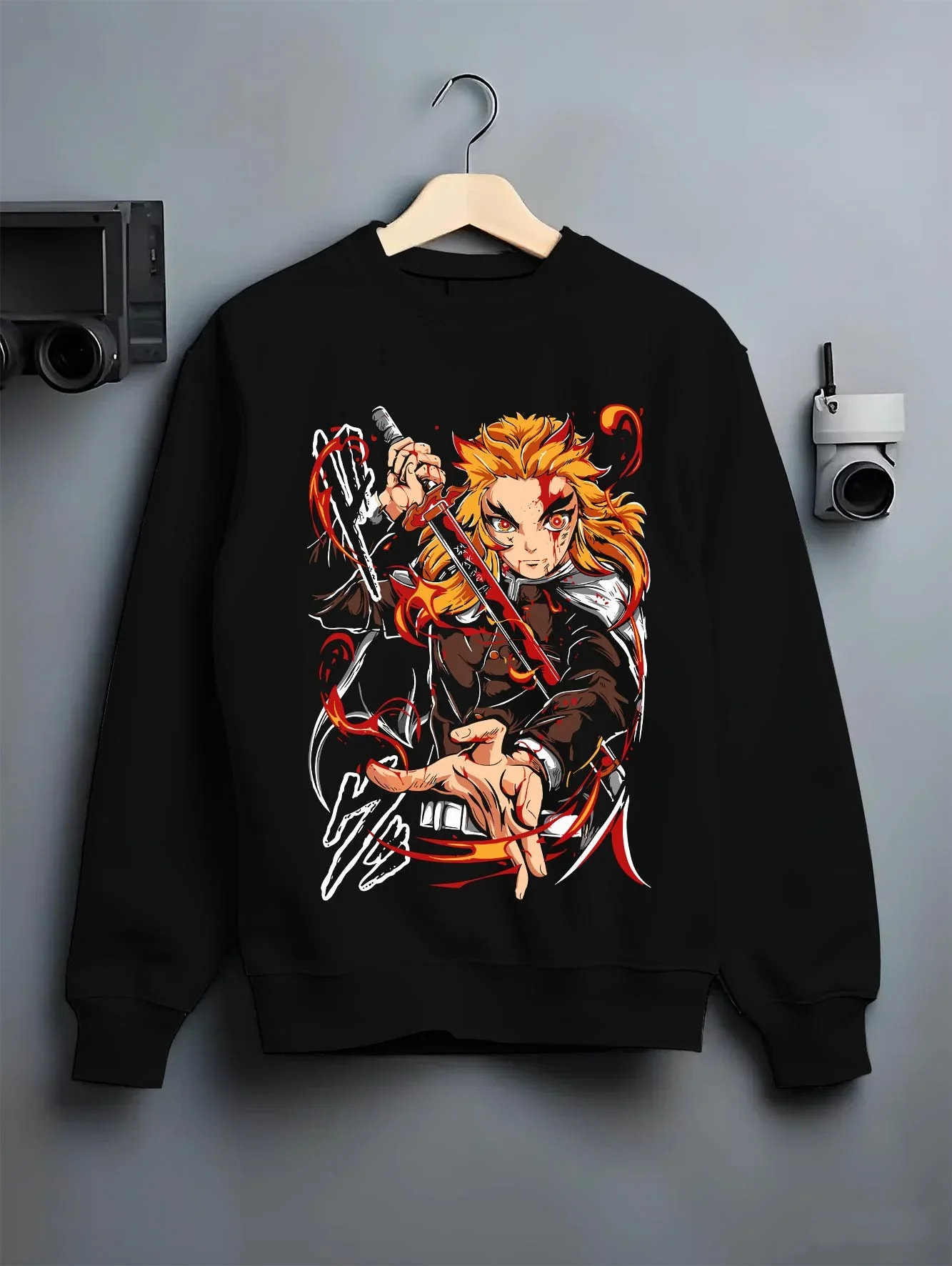 Black crewneck sweatshirt on hanger with Kyojuro Rengoku Hoodie Demon Slayer Flame Pillar graphic premium wear.