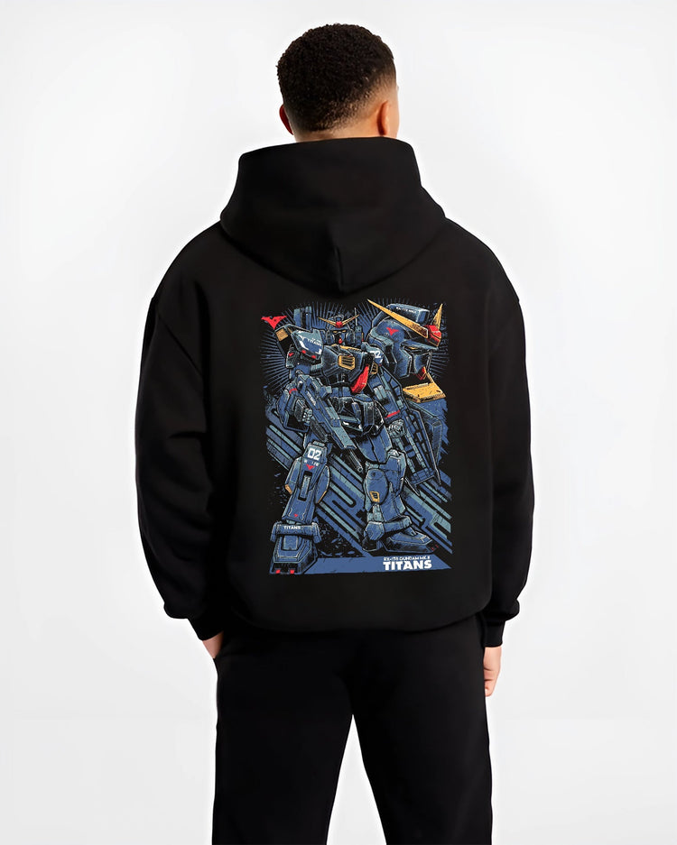 Black hoodie worn by a male model, back view, featuring Gundam Titans retro manga inspired design with giant mecha suit in Japanese animation streetwear style.
