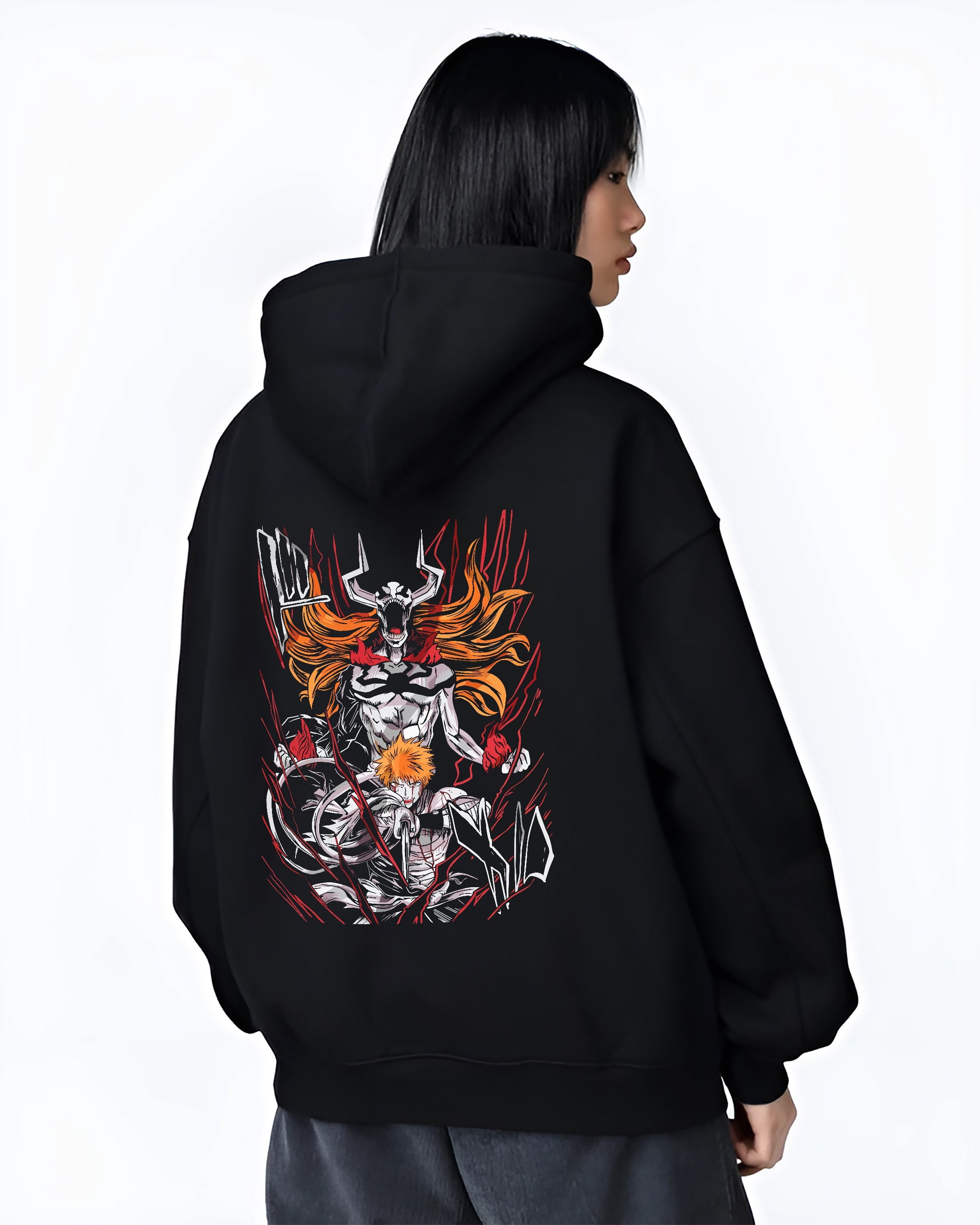 Black hoodie worn by a female model, back view, featuring Ichigo Bleach dark manga panel artwork with hollow transformation in bold retro anime streetwear graphic.