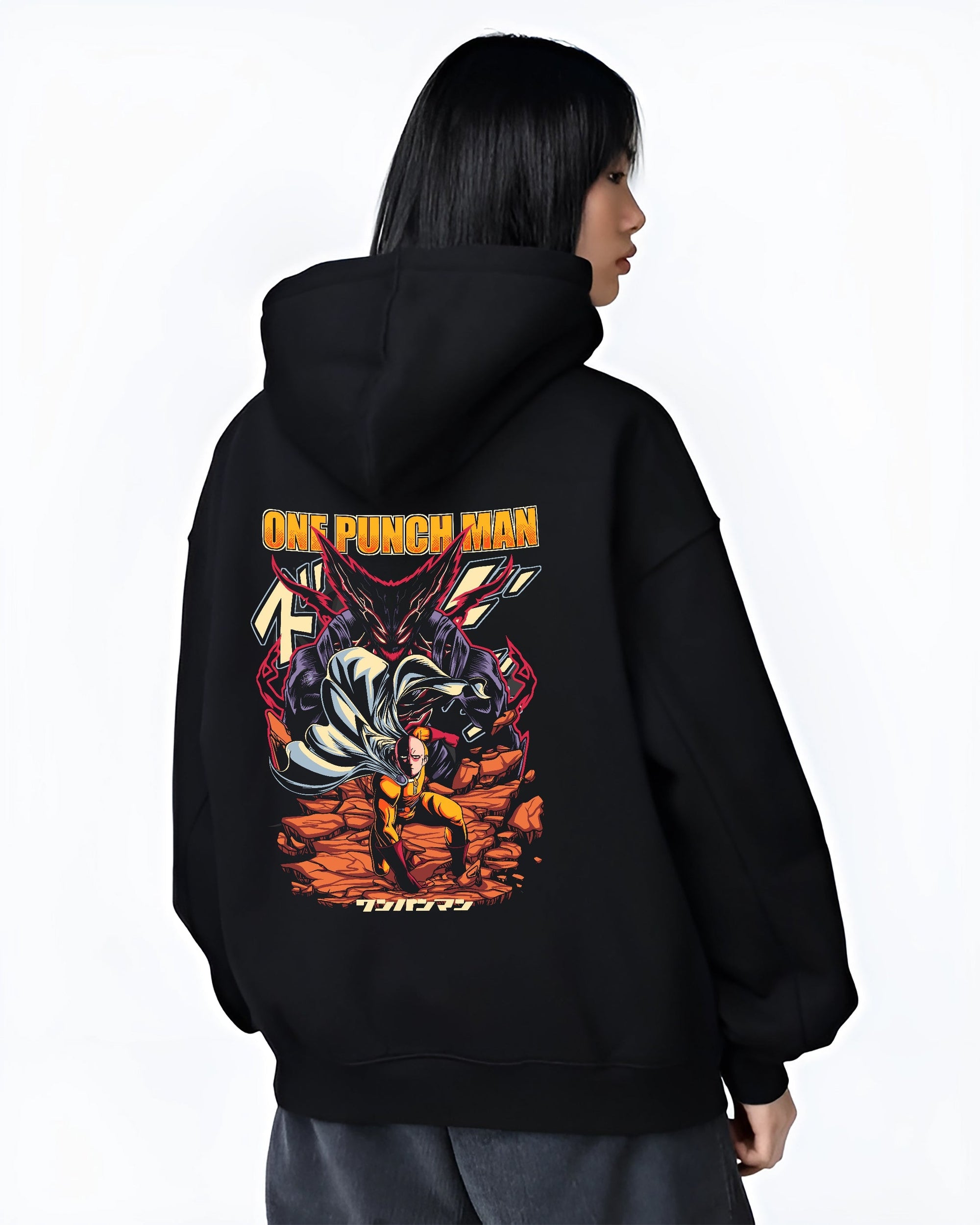 Black hoodie worn by a female model, back view, featuring One Punch Man anime poster inspired artwork with Saitama facing Garou in dramatic urban fashion design.