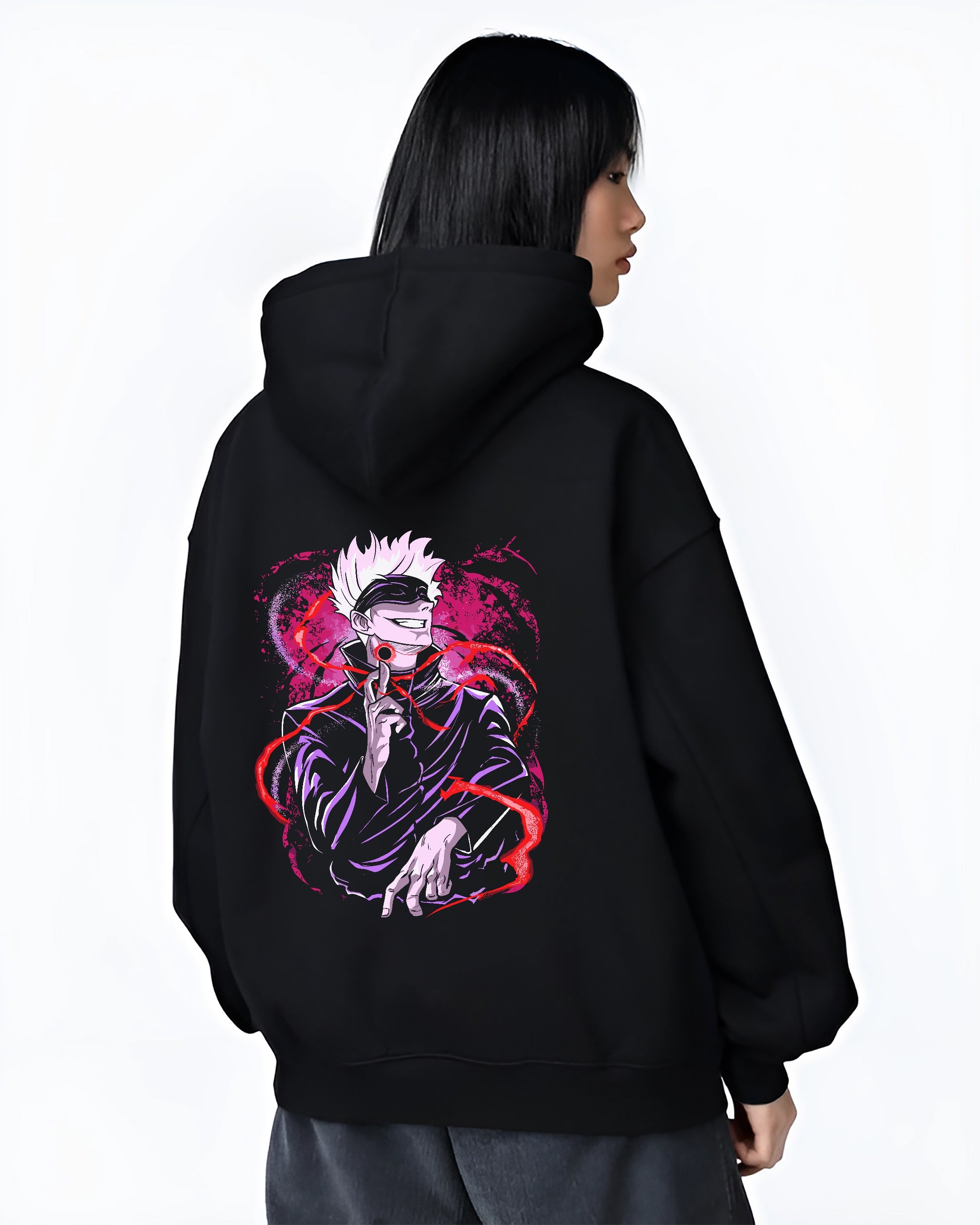 Black hoodie worn by a female model, back view, featuring Gojo Satoru retro manga artwork with swirling magenta aura and urban streetwear vibe.